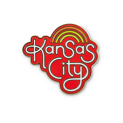 red die cut enamel pin with kansas city hand lettering and rainbow