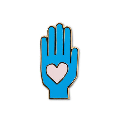 blue die cut hand enamel pin with pink heart in center