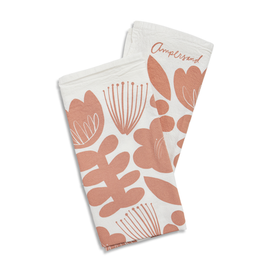 white flour sack towel napkins with blush floral shapes