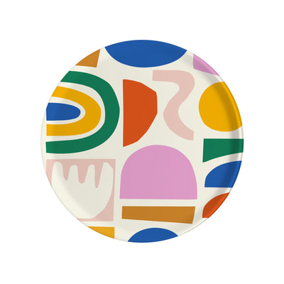 colorful cut paper shapes on round birchwood tray